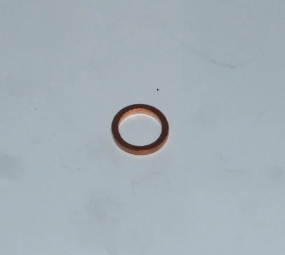 Kupferdichtring, eingesetzt bei Daikin-Geräten, auf weißem Hintergrund. Der Ring hat eine runde Form und könnte für Ölvorwärmnippel verwendet werden.